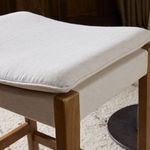 Top view of Aya Counter Stool displaying cushioned seat fabric and oak frame edges
