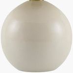 Close-up of round beige ceramic base with glossy finish