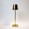 Vera Gold Poldina Pro Table Lamp viewed slightly from the right side with soft lighting on white background