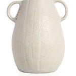 Rear view highlighting the vase’s soft cream glaze with subtle textured carving across the back