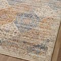 Close-up view of rug surface showing faded diamond motifs and warm color blending