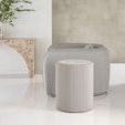 Mantra Side Table shown next to a grey armchair in a minimalist room with reflective white flooring and neutral walls