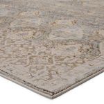 Close-up detail showing metallic gold sheen and plush pile of Hakeem rug corner