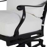 Close-up of chair armrest’s detailed curves and attachment to base frame