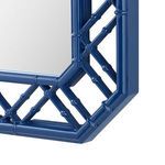 Detailed corner view of the mirror frame illustrating polished finish and bamboo-inspired design