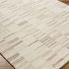angled close-up of Max Sandstone Handmade Rug displaying its soft wool texture and subtle color transitions