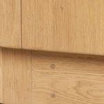 Close-up on oak base showing detailed wood joinery and finish
