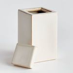 Jar with lid removed, showing interior and separate square lid placed beside it