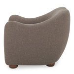 Side profile of Bria Accent Chair highlighting rounded back and arm contours with brown textured upholstery