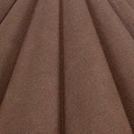 Detailed texture of dark brown scalloped fabric shade with visible weave