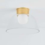 Lakeside Flush Mount lit, shown from below angle revealing smooth clean underside of clear glass bowl