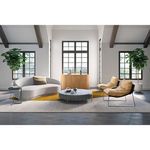 Excelsior sofa in bright airy room with wood beams, tall black-trimmed windows, and plants