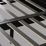 Detailed view of bed slats on black metal platform base