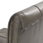 Side view close-up showing leather upholstery folds and seam on rolled backrest edge