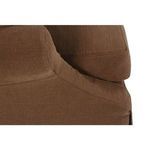 Detailed view of sofa arm curves and slipcover seam with rich terracotta linen fabric