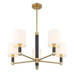 Top-down angle of chandelier showing arrangement of five white fabric shades