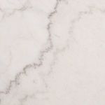 Close-up detail of white marble top showing fine gray and light brown veining