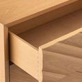 Open top drawer showing dovetail joints and interior wood finish