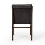 Back view showing leather stretched over chair back and simple clean burnt oak frame