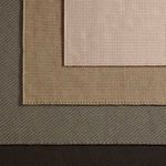 Stacked rugs showing border texture and different color shades layered