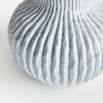 Close-up of ribbed blue texture showing artisan glaze and subtle color shifts on vase surface