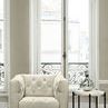 Nicolla Chair styled in bright room next to round marble and black metal side table