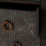 Close-up of dresser drawer wood grain texture and antique brass ring pull hardware
