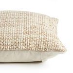 Side profile showing pillow depth and cream solid fabric back