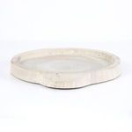 Low side angle capturing the thickness of tray edge and subtle wood grain contrast