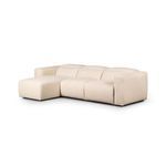 Three-quarter left angle side view of the sectional showing thick square arms and chaise extension