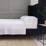 White Como Ladder Stitch Cotton Sateen pillowcases on bed with subtle ladder stitch detailing