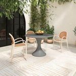 Three Soren chairs arranged outdoors around a round gray pedestal table with potted plants in background