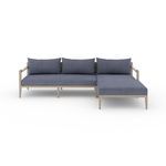 Front view of sectional highlighting straight armrests and three back cushions