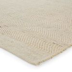 Close-up showing textured chevron weave and natural fiber mix of wool and jute in the rug
