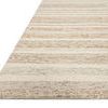 Low-angle shot showing texture and layered beige stripes on Chris Ivory Clay Rug