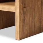 Close-up of bottom table leg and side panel showing rough wood texture and joinery detail