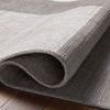 Close-up of the rug folding, revealing thickness and layered looped yarn texture