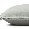 Side profile view highlighting the pillow's soft texture and fringed raw edge detail