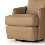 Lower angle view focusing on base and thick front cushion with leather upholstery