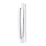 Flute Sconce with a soft shadow on the wall showcasing its tall, smooth steel curves