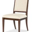 Upholstered dining chair angled slightly more forward showing thicker seat cushion detail