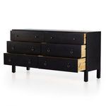 Three drawers partially open revealing natural wood interior of poplar dresser
