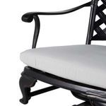 Curled armrest and seat cushion edge close-up on swivel rocker chair