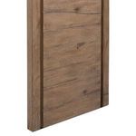 Detail of wood grain and natural imperfections along the vertical side panel