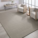Rug styled in a bright modern living room with wood framed chairs and console