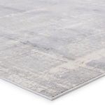 Low angle close-up showing thin edge and textured abstract pattern of Lavato rug