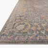 Close-up low angle view showing textured polypropylene and polyester pile with intricate design and muted colors