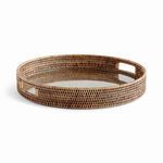 Round Burma rattan serving tray with warm brown woven frame and sturdy clear glass insert
