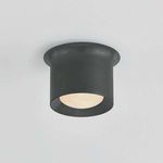 Noxon flush mount ceiling light illuminated, showing soft warm light through matte cloud glass shade