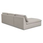 Back view of beige sectional showing smooth fabric upholstery and cushion backs